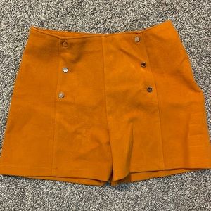 High wasted orange shorts